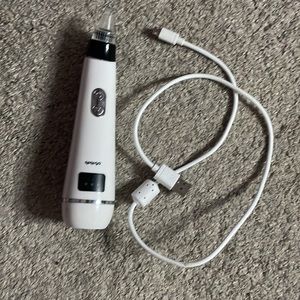White, and black Blackhead remover machine